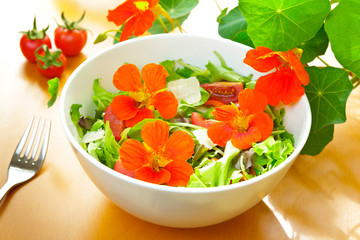salad bowl nasturtium flowers fork - obrazy, fototapety, plakaty