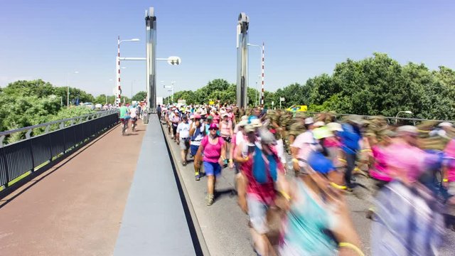 Crowd of people crossing a bridge during the four-days marches Nijmegen (Vierdaagse), Netherlands, 4K time lapse