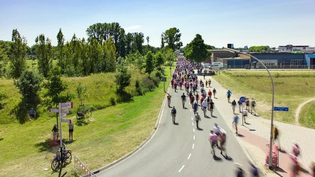 Crowd of people walking on the road during the four-days marches Nijmegen (Vierdaagse), Netherlands, 4K time lapse