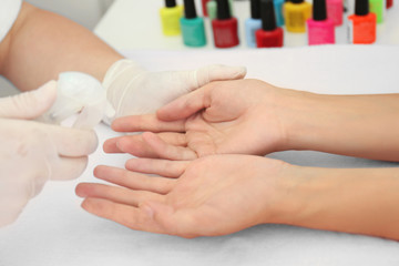 Obraz na płótnie Canvas Woman getting a manicure in a beauty salon, close up