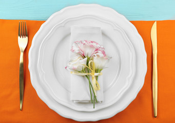 Beautiful table setting with flowers