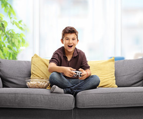 Happy kid playing video games