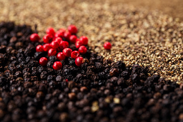 whole, crashed and ground black and red peppercorns