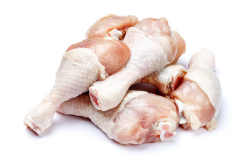 Raw chicken legs on a white background
