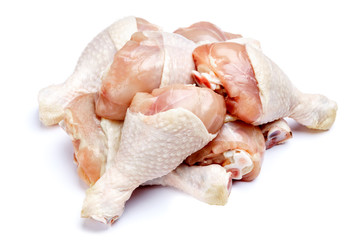 Raw chicken legs on a white background