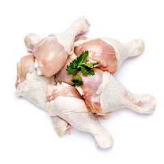 Raw chicken legs on a white background