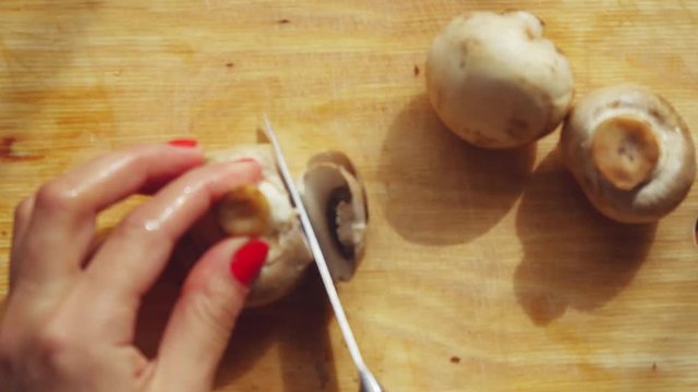 Cooking cutting mushrooms in the kitchen. 1920x1080