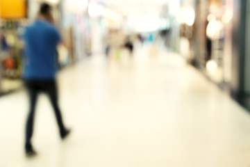 Blur store with bokeh background. Silhouettes of Business People