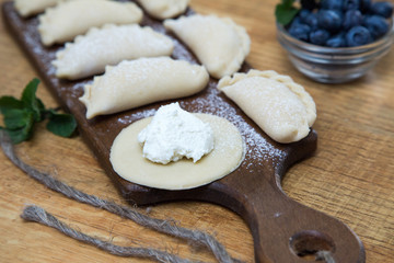 Dumplings with cottage cheese and blueberry