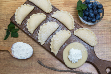 Dumplings with cottage cheese and blueberry