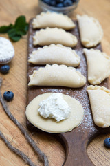 Fototapeta na wymiar Dumplings with cottage cheese and blueberry