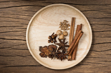 still life photography : various herb and spice in wood dsish on old wood