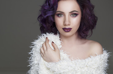 Portrait of beautiful fashion model with violet hair