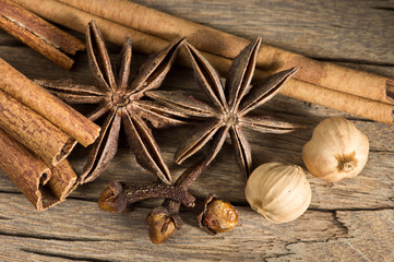 Herbs and spices on wood background