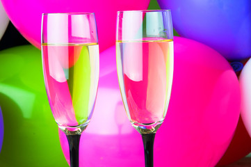 Two glasses of champagne and balloons on party