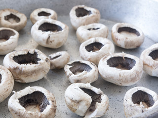 White mushrooms in a old aluminium plate