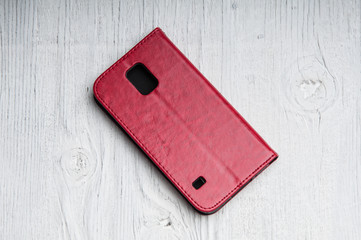 Rear cover for smartphone on wooden background