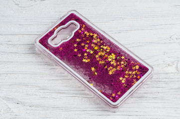 Rear cover for smartphone on wooden background