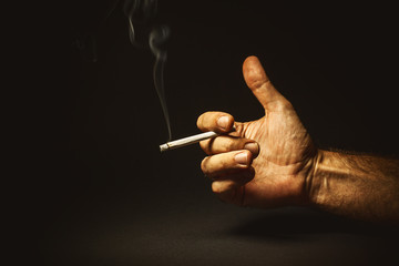 Male Hand Holding a Cigar