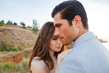 Fototapeta premium Close up portrait of a beautiful married couple