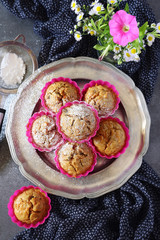  Carrot muffins with  icing sugar and flowers