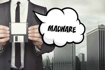 Malware text on speech bubble with businessman