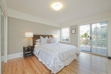 Bedroom with Wooden Floor and Sliding Glass Door leading to Balc