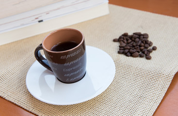 Cup  espresso black coffee and roasted beans