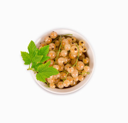 Ripe and tasty white currant isolated on white background. Top view. White currants with green leaves.