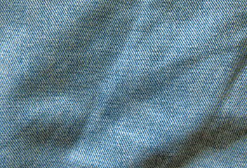 Light blue jeans texture. Fabric background.