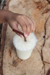 iced milk is delicious on wood background.
