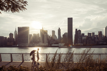 People walking along the East River Bay in Long Island City - 119062216
