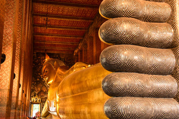The Golden Reclining Buddha of Wat Pho in Bangkok, Thailand