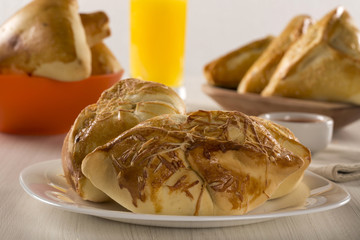 Brazilian snack fried with cheese ham on wooden background.