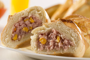 Brazilian snack fried with cheese ham on wooden background.