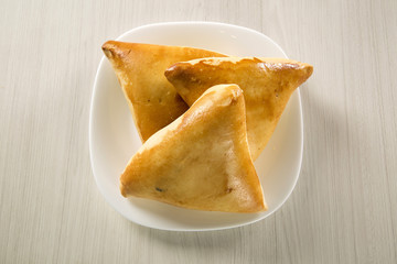 Brazilian snack. Meat Esfiha on the table