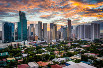View of the skyline of Makati at sunset, in Metro Manila, The Ph - obrazy, fototapety, plakaty