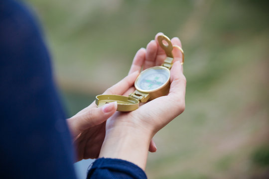 Compass in female hand