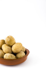 Canarian potatoes (papas arrugadas) isolated on white background

