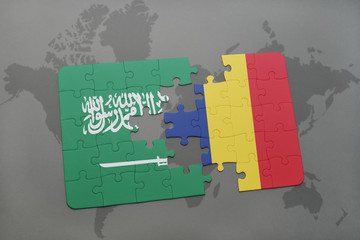 puzzle with the national flag of saudi arabia and chad on a world map background.