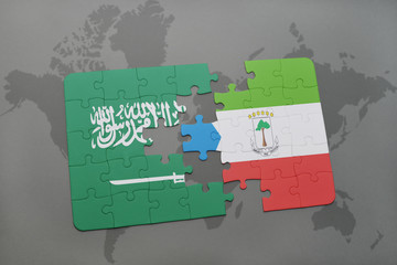 puzzle with the national flag of saudi arabia and equatorial guinea on a world map background.