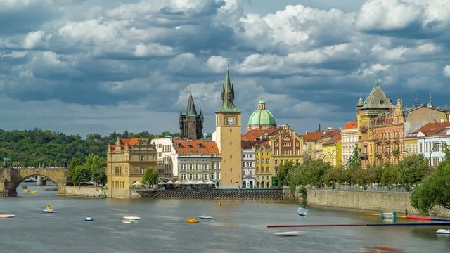 Charles Bridge and historical buildings timelapse in Prague from across the river. Staromestsky water tower. Prague, Czech Republic.