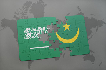 puzzle with the national flag of saudi arabia and mauritania on a world map background.