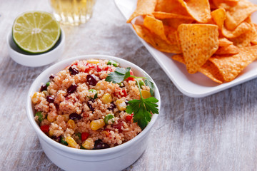 homemade vegetarian couscous with tomato corn beans green peas