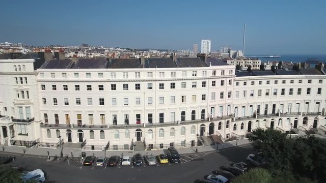 Aerial view of a regency square in Brighton and Hove with the town and the beach in the background