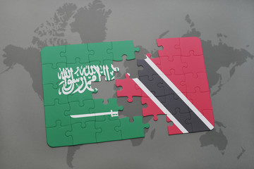 puzzle with the national flag of saudi arabia and trinidad and tobago on a world map background.