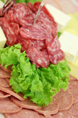 Sausage slices with  lettuce leaf