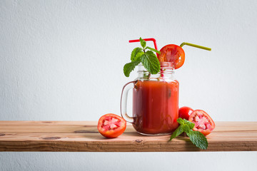 Fresh cocktail with tomato juice on wooden counter bar, rustic style