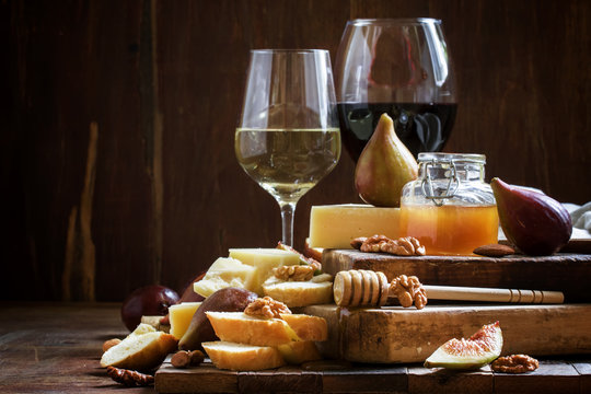 White and red wine, cheese, figs, nuts, honey and bread, vintage