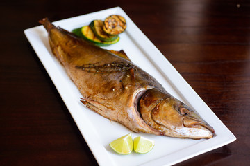 grilled tuna on a white plate served.